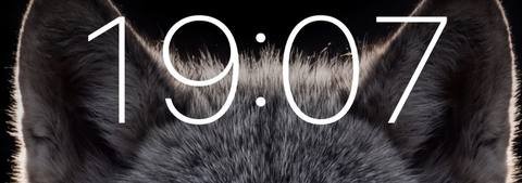 Detail of the Lock Screen: the wolf’s ears stand in front of the clock digits, and the digits stay legible.